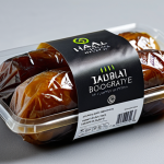 Sustainable Food Packaging**

"Close-up shot of innovative food packaging made with nanotechnology. Focus on a biodegradable wrap encasing fresh dates. Label should show "Halal" certification. Soft, diffused lighting, showcasing the texture and detail. safe for work, appropriate content, fully clothed, professional food photography, natural colors, perfect anatomy (for any hands visible)."

**